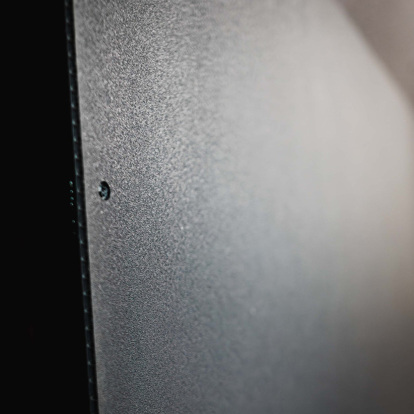 Close up view of Legend DuraTherm Textured Grey Surface used for a ceiling liner in Ford Transit Cargo Van